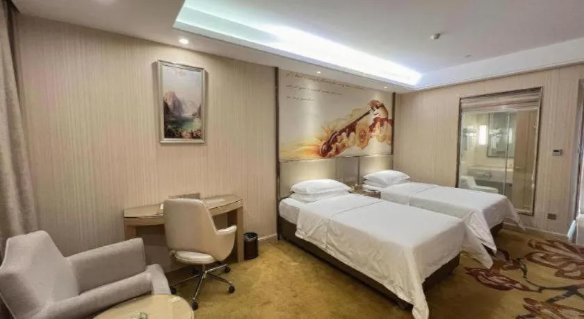 Bed in Vienna Hotel Guangdong Huidong Herung Pedestrian Street