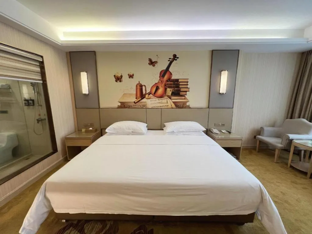 Bed in Vienna Hotel Guangdong Huidong Herung Pedestrian Street