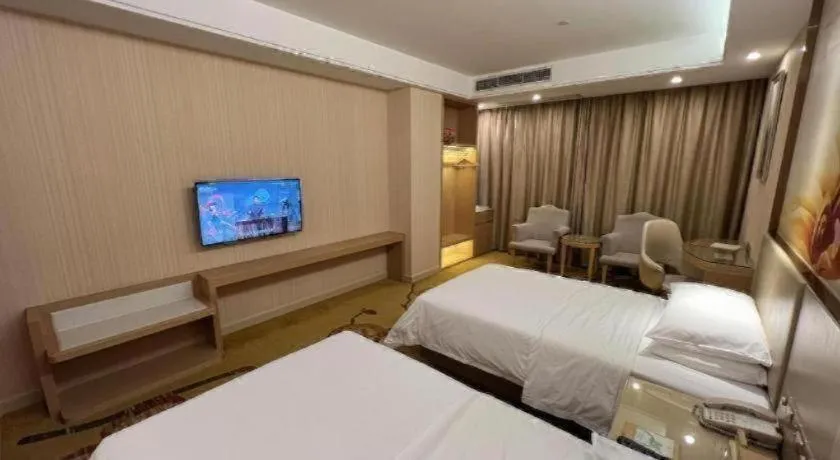 Bed in Vienna Hotel Guangdong Huidong Herung Pedestrian Street