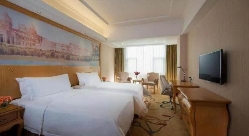 Bed in Vienna Hotel Guangdong Huidong Herung Pedestrian Street