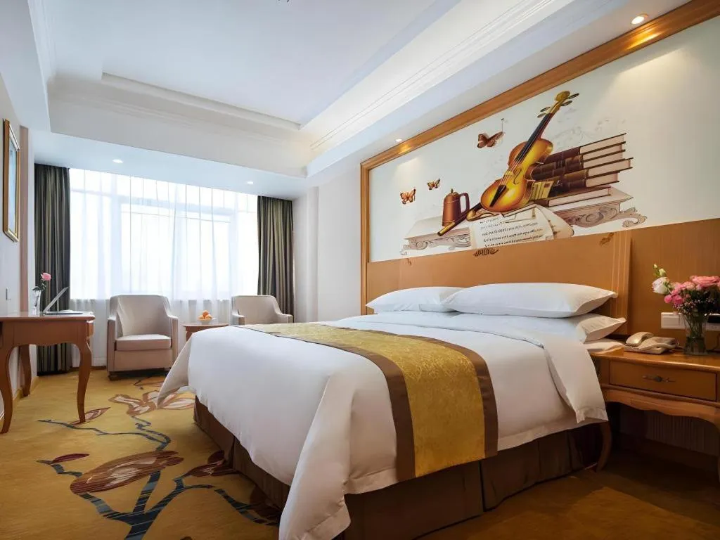 Bed in Vienna Hotel Guangdong Huidong Herung Pedestrian Street