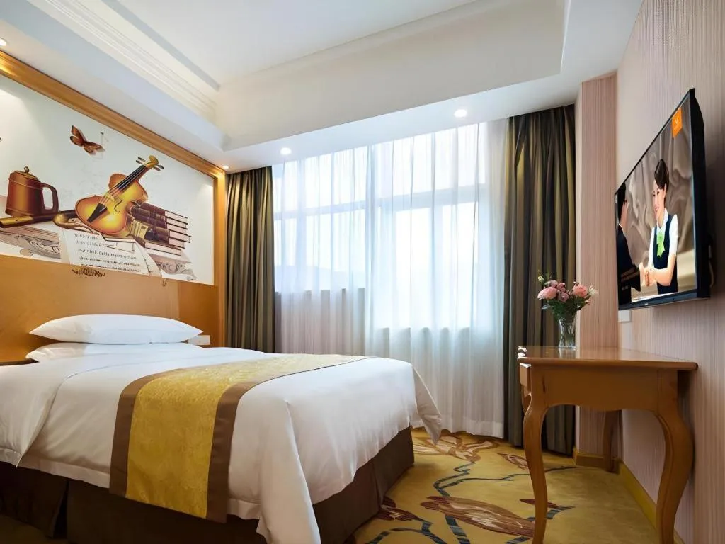 Bed in Vienna Hotel Guangdong Huidong Herung Pedestrian Street