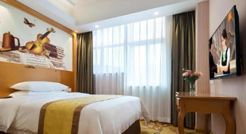 Bed in Vienna Hotel Guangdong Huidong Herung Pedestrian Street