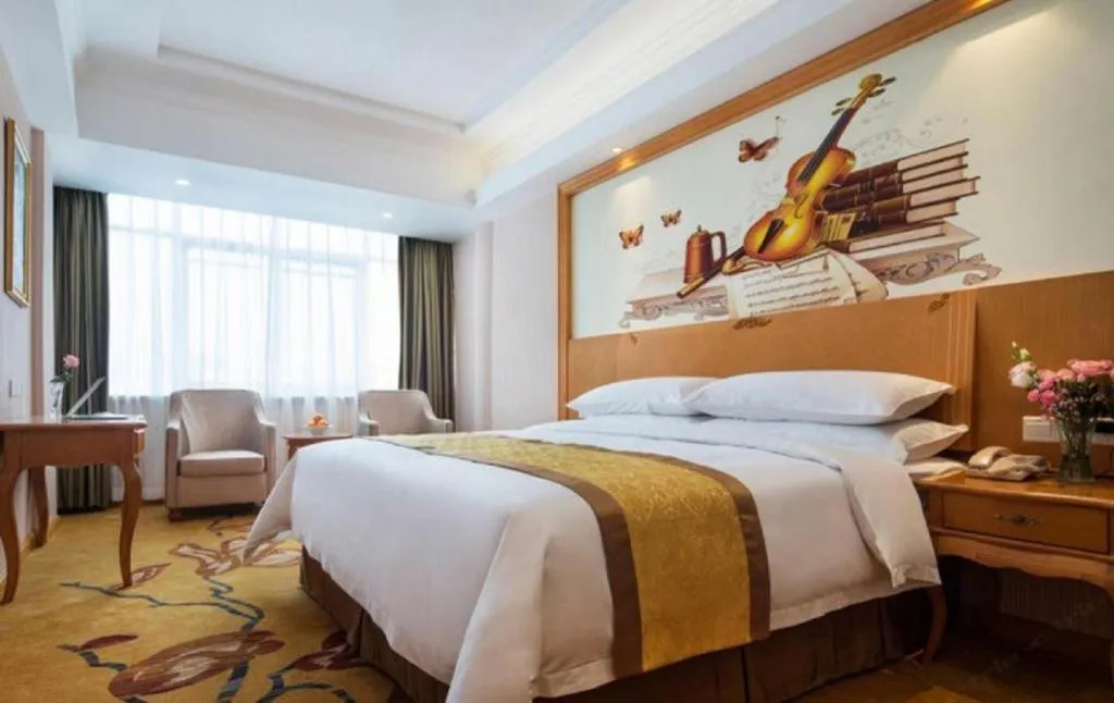 Bed in Vienna Hotel Guangdong Huidong Herung Pedestrian Street