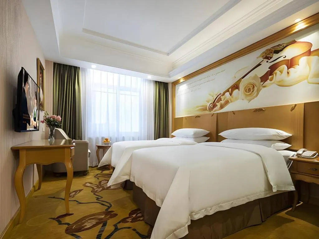 Bed in Vienna Hotel Guangdong Huidong Herung Pedestrian Street