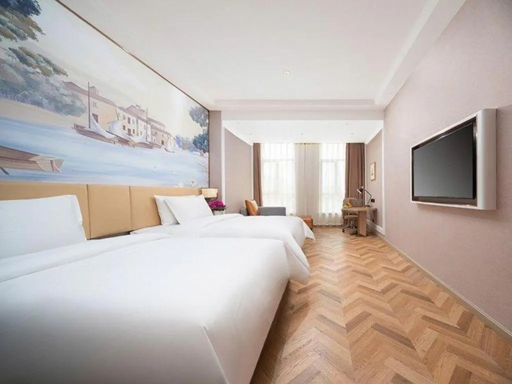 Bed in Vienna Hotel Lincang New Asia Pacific Times Square