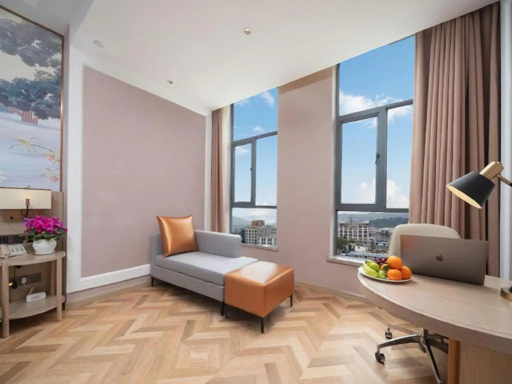 Bed in Vienna Hotel Lincang New Asia Pacific Times Square