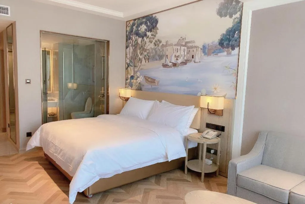 Bed in Vienna Hotel Lincang New Asia Pacific Times Square