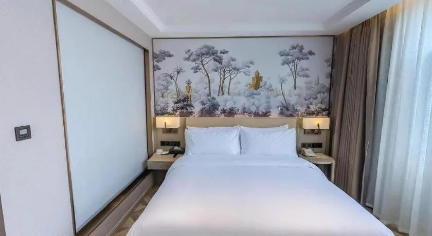 Bed in Vienna Hotel Lincang New Asia Pacific Times Square