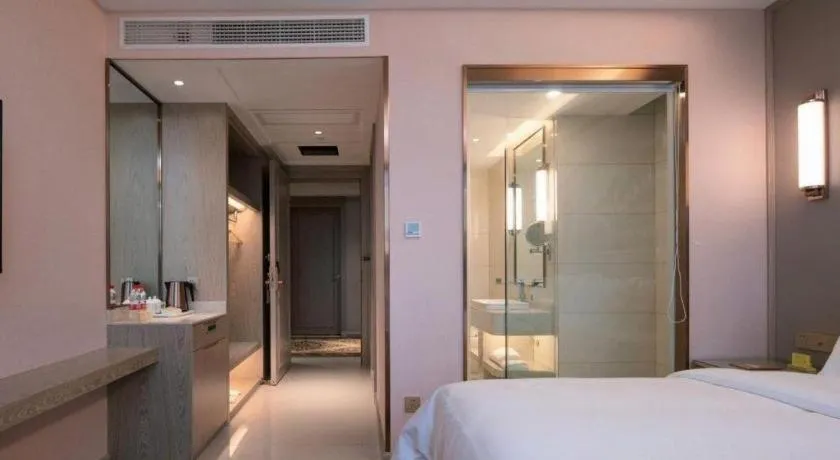 Bed in Vienna Hotel Lincang New Asia Pacific Times Square