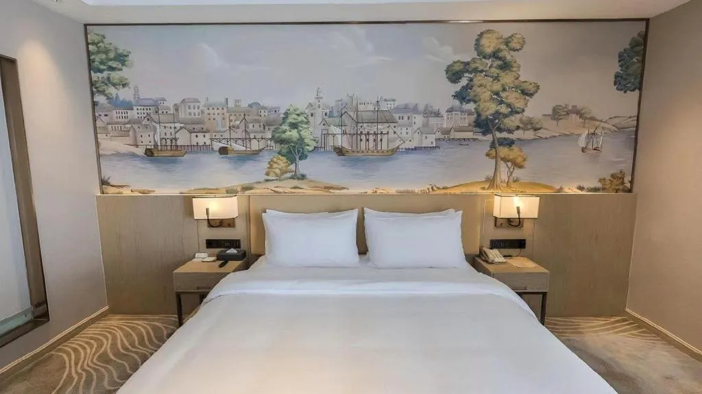 Bed in Vienna Hotel Lincang New Asia Pacific Times Square