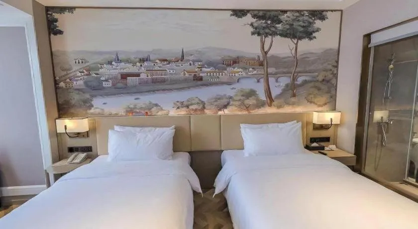 Bed in Vienna Hotel Lincang New Asia Pacific Times Square