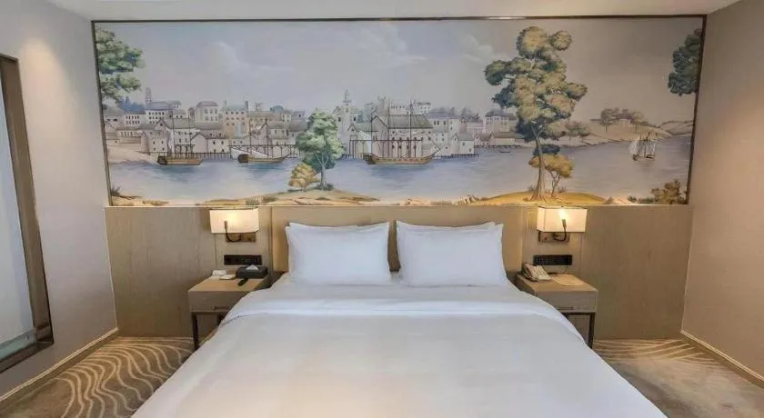 Bed in Vienna Hotel Lincang New Asia Pacific Times Square