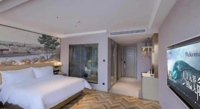 Bed in Vienna Hotel Lincang New Asia Pacific Times Square