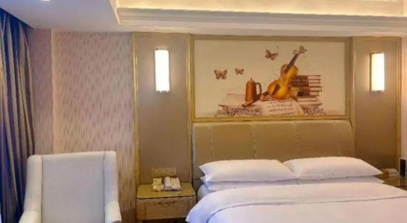 Bed in Vienna Hotel Guangxi Zhongshan Central Plaza West High-Speed Railway Station