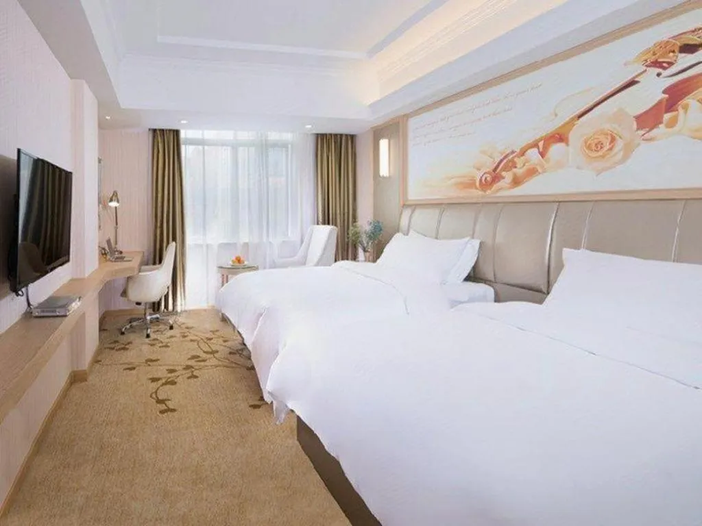 Bed in Vienna Hotel Guangxi Zhongshan Central Plaza West High-Speed Railway Station