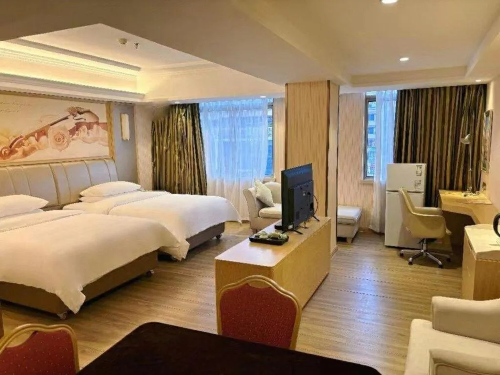 Bed in Vienna Hotel Guangxi Zhongshan Central Plaza West High-Speed Railway Station