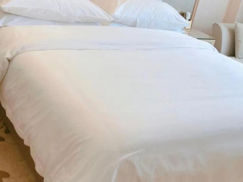 Bed in Vienna Hotel Guangxi Zhongshan Central Plaza West High-Speed Railway Station