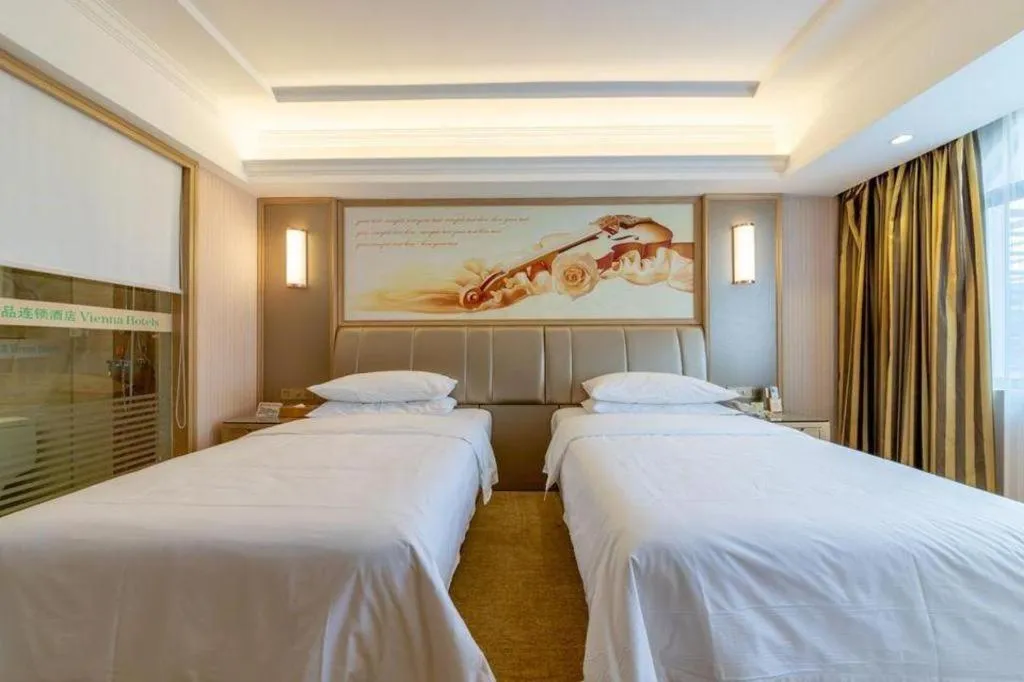 Bed in Vienna Hotel Guangxi Zhongshan Central Plaza West High-Speed Railway Station