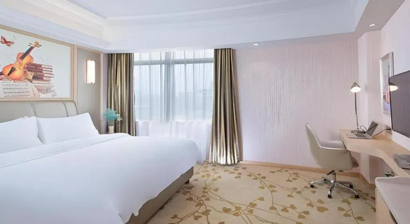 Bed in Vienna Hotel Guangxi Zhongshan Central Plaza West High-Speed Railway Station