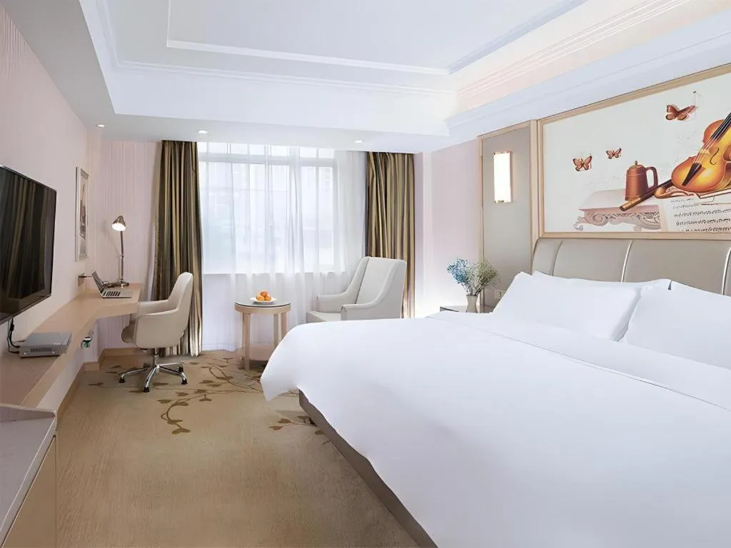 Bed in Vienna Hotel Guangxi Zhongshan Central Plaza West High-Speed Railway Station