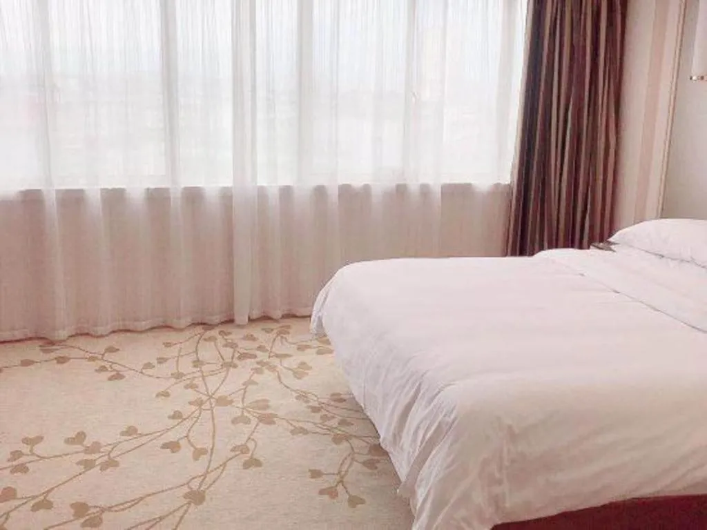 Bed in Vienna Hotel Guangxi Zhongshan Central Plaza West High-Speed Railway Station