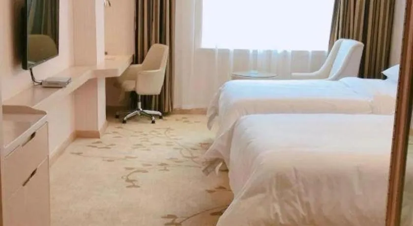 Bed in Vienna Hotel Guangxi Zhongshan Central Plaza West High-Speed Railway Station