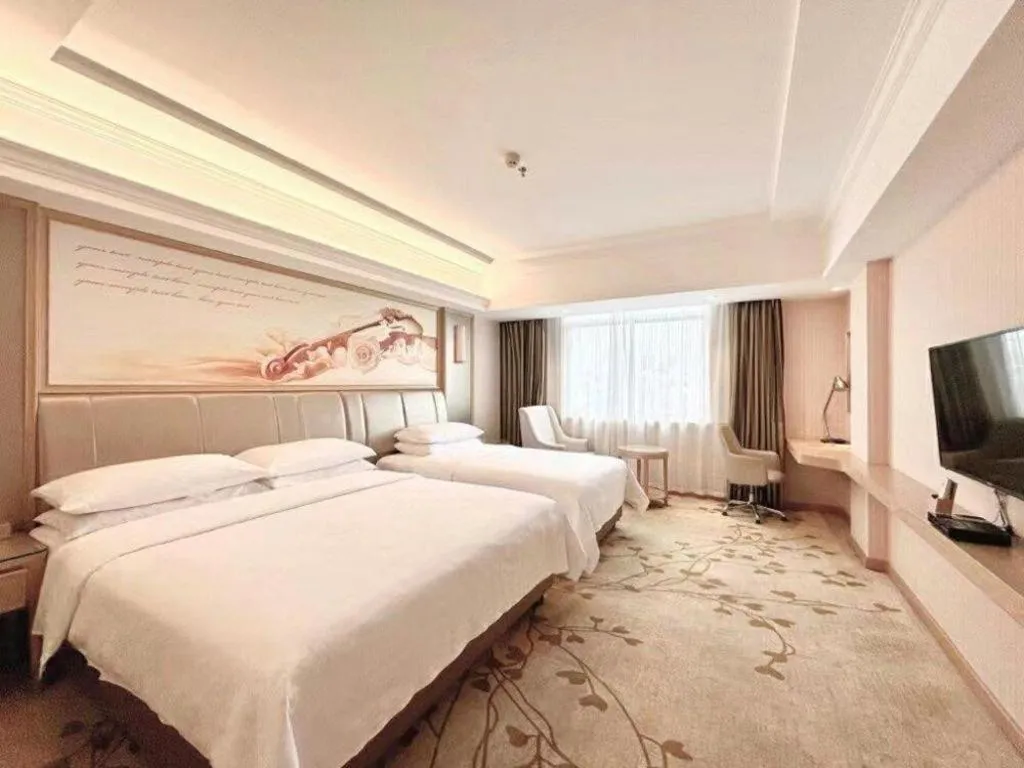 Bed in Vienna Hotel Guangxi Zhongshan Central Plaza West High-Speed Railway Station