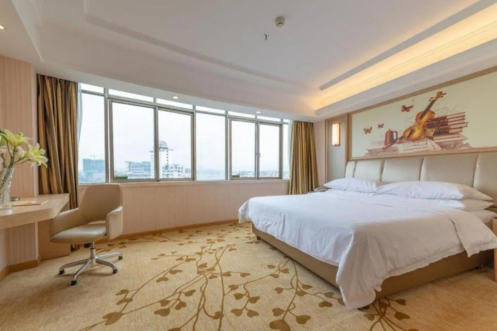 Bed in Vienna Hotel Guangxi Zhongshan Central Plaza West High-Speed Railway Station