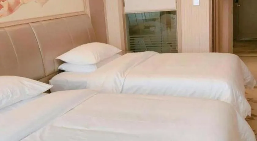 Bed in Vienna Hotel Guangxi Zhongshan Central Plaza West High-Speed Railway Station