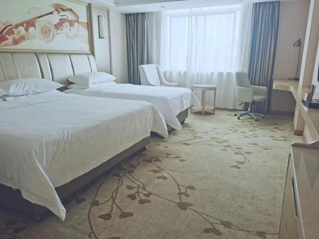 Bed in Vienna Hotel Guangxi Zhongshan Central Plaza West High-Speed Railway Station