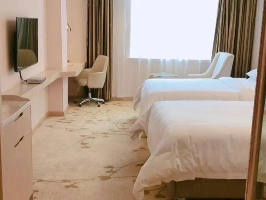 Bed in Vienna Hotel Guangxi Zhongshan Central Plaza West High-Speed Railway Station