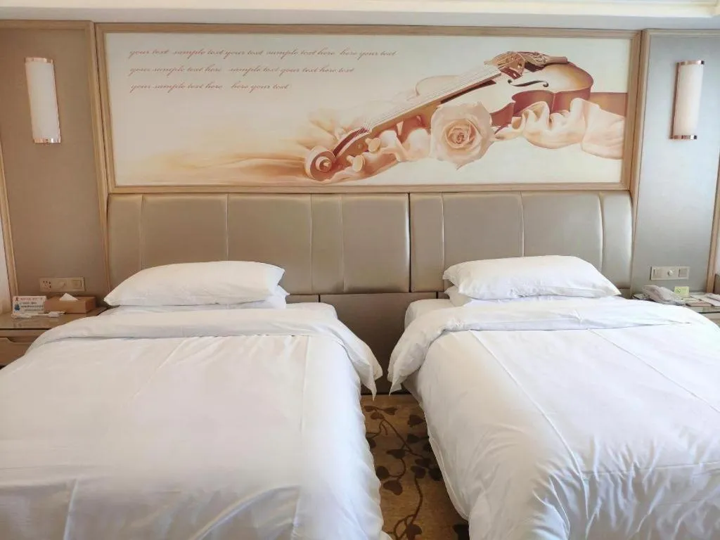 Bed in Vienna Hotel Guangxi Zhongshan Central Plaza West High-Speed Railway Station
