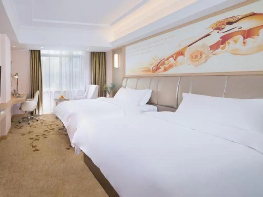 Bed in Vienna Hotel Guangxi Zhongshan Central Plaza West High-Speed Railway Station