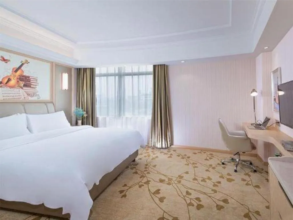 Bed in Vienna Hotel Guangxi Zhongshan Central Plaza West High-Speed Railway Station