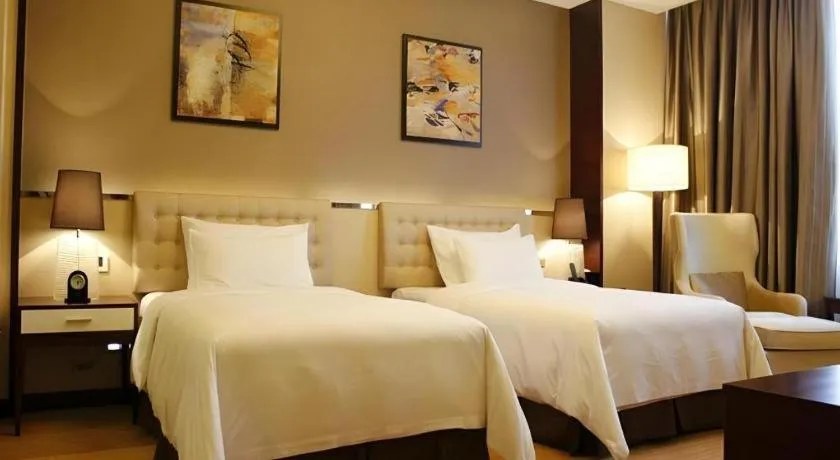 Bed in Venus Royal Hotel Shenzhen International Exhibition Center