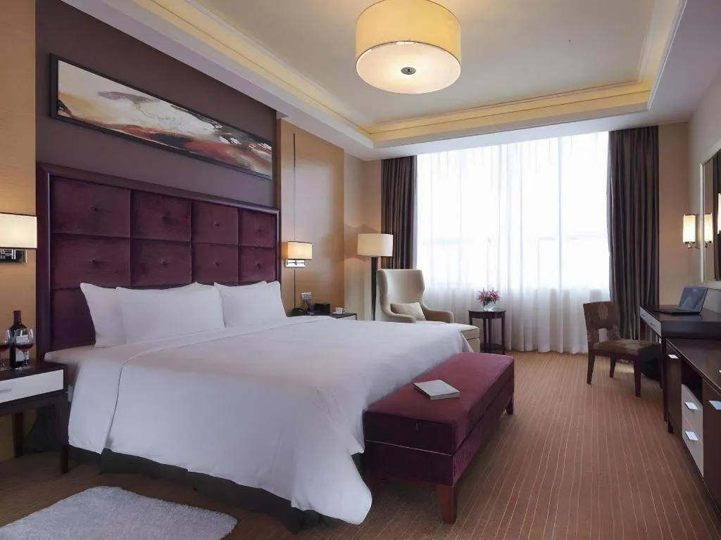 Bed in Venus Royal Hotel Shenzhen International Exhibition Center