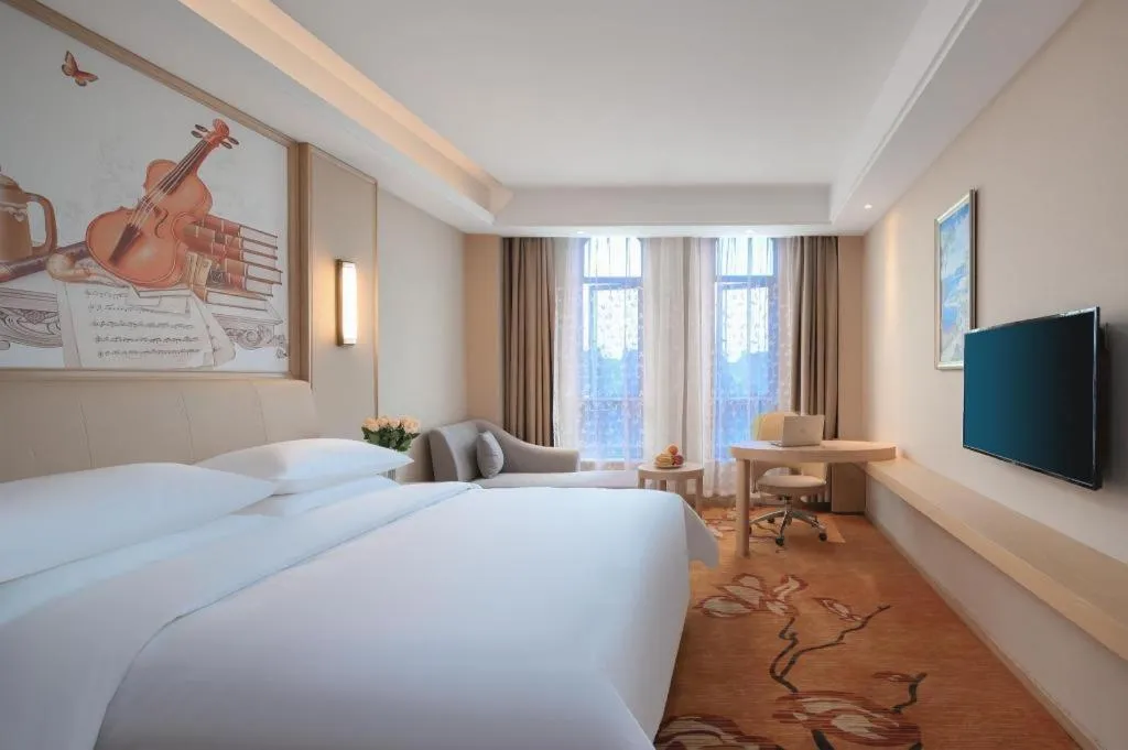 Bed in Vienna Hotel Zhejiang Tongxiang Puyuan