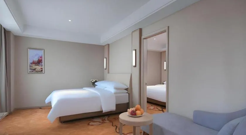 Bed in Vienna Hotel Zhejiang Tongxiang Puyuan