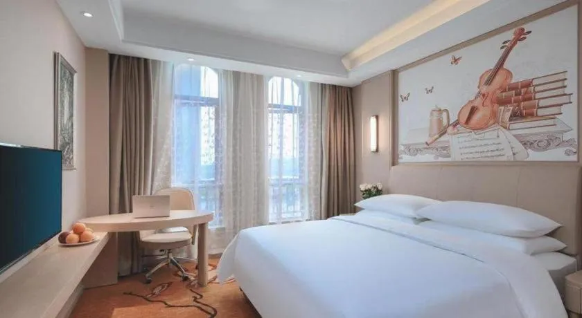 Bed in Vienna Hotel Zhejiang Tongxiang Puyuan