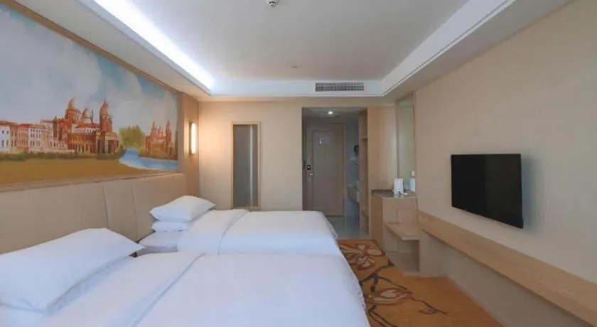 Bed in Vienna Hotel Zhejiang Tongxiang Puyuan