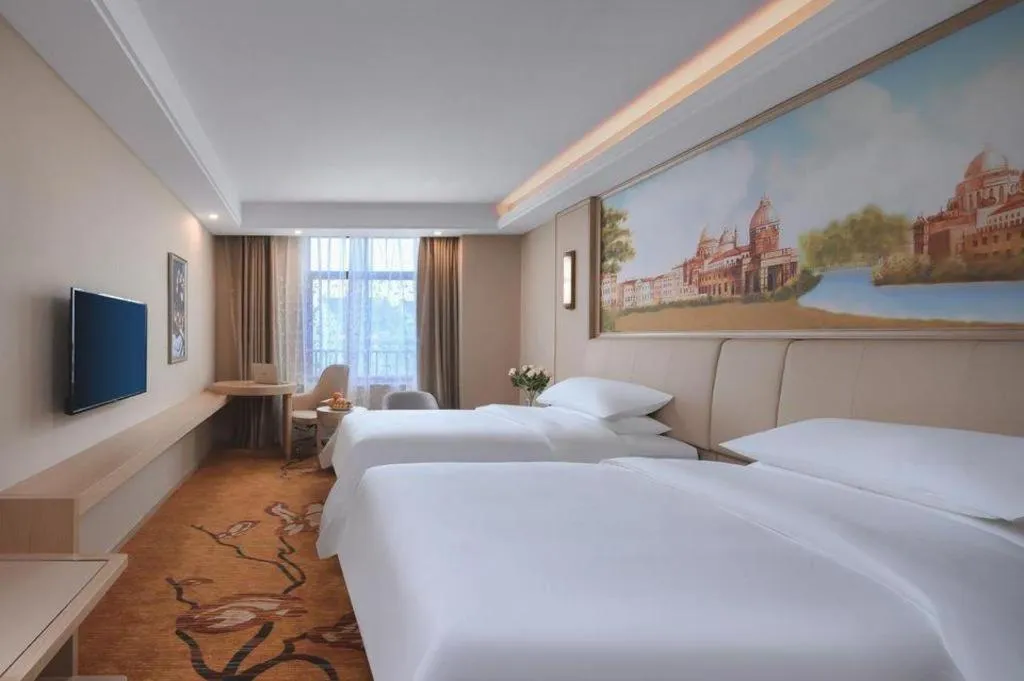 Bed in Vienna Hotel Zhejiang Tongxiang Puyuan