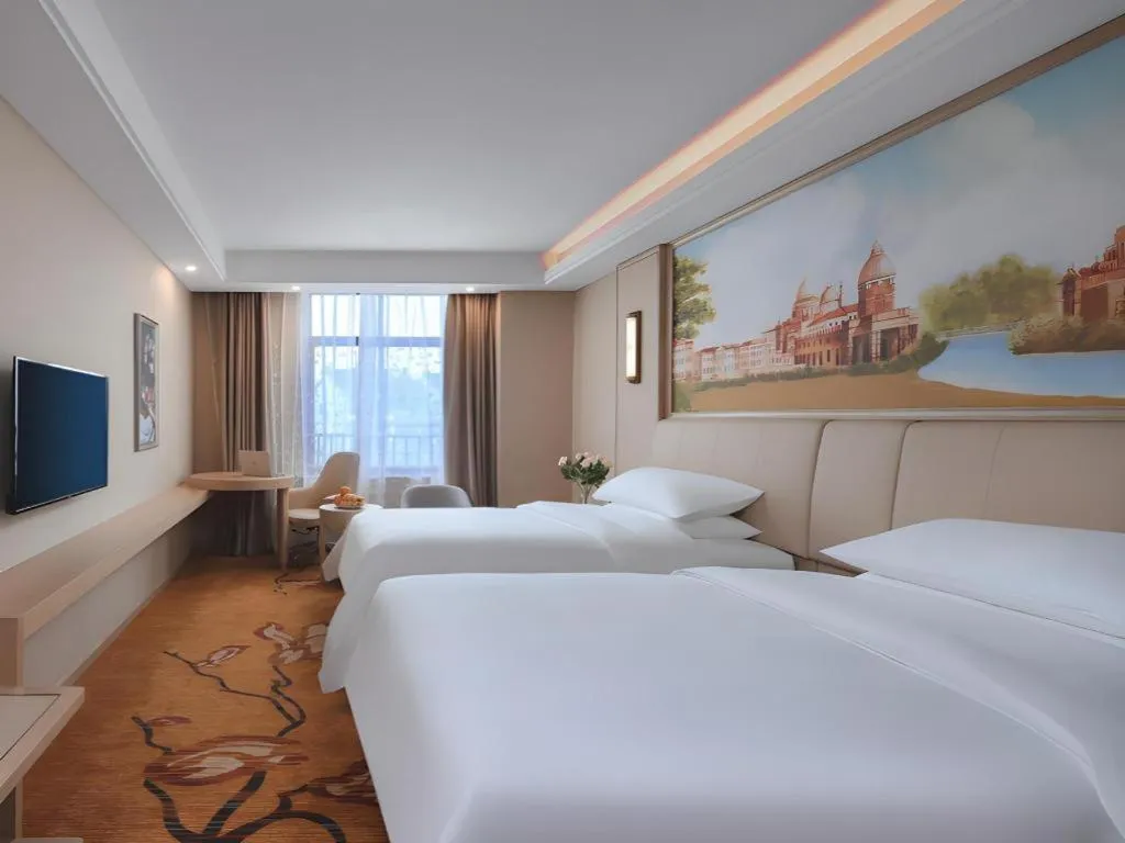 Bed in Vienna Hotel Zhejiang Tongxiang Puyuan