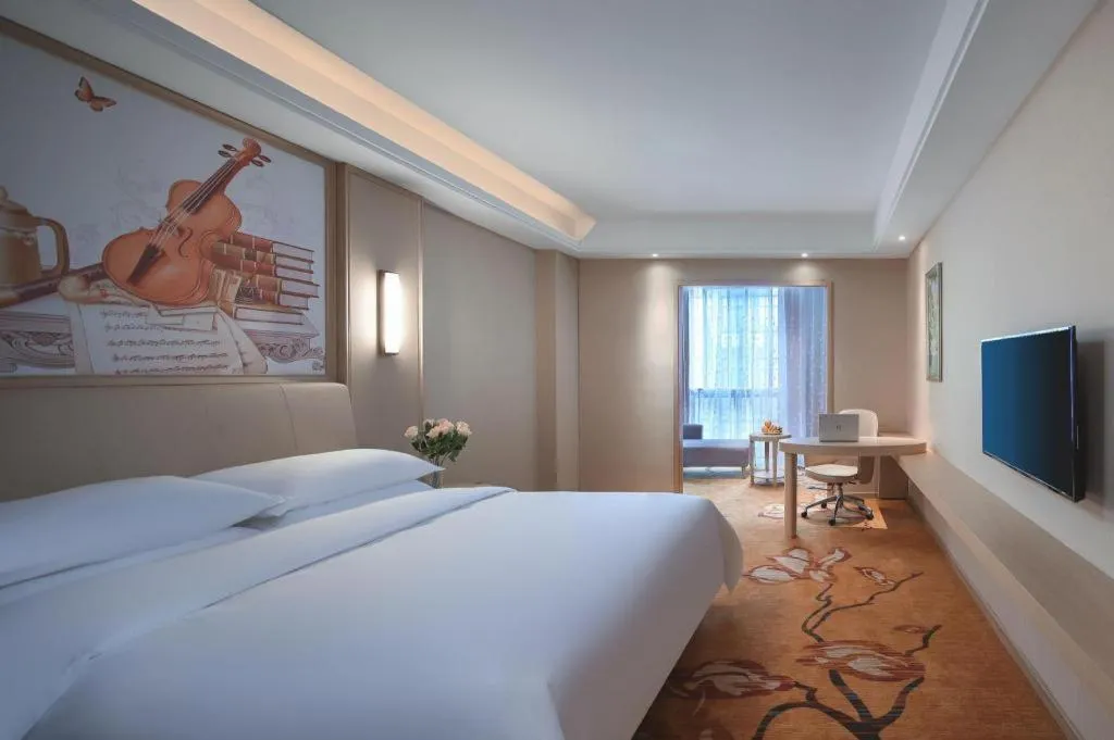 Bed in Vienna Hotel Zhejiang Tongxiang Puyuan