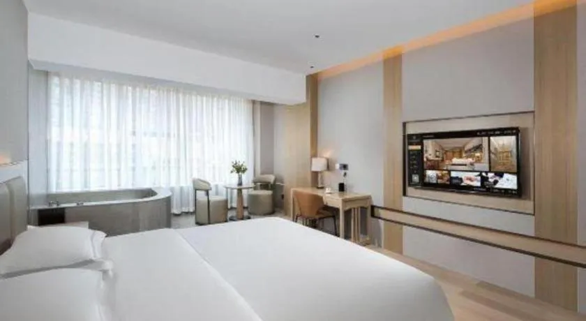 Bed in Vienna Hotel Yunnan Maitreya Huquan