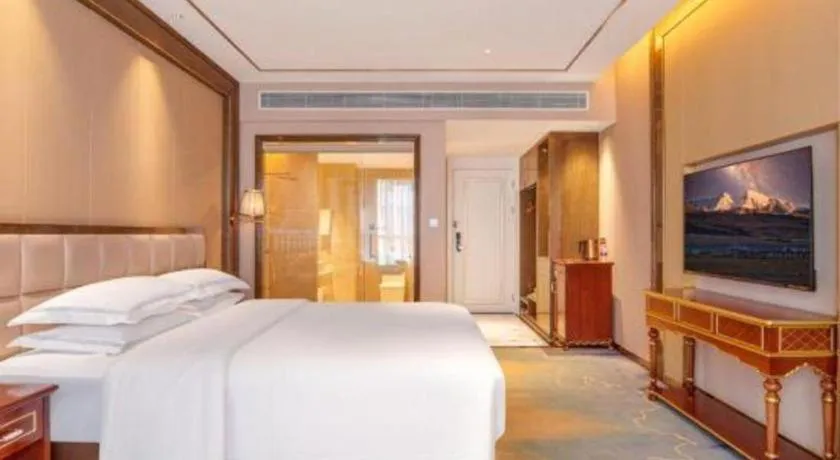 Bed in Vienna Hotel Yunnan Maitreya Huquan