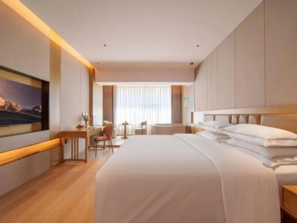 Bed in Vienna Hotel Yunnan Maitreya Huquan