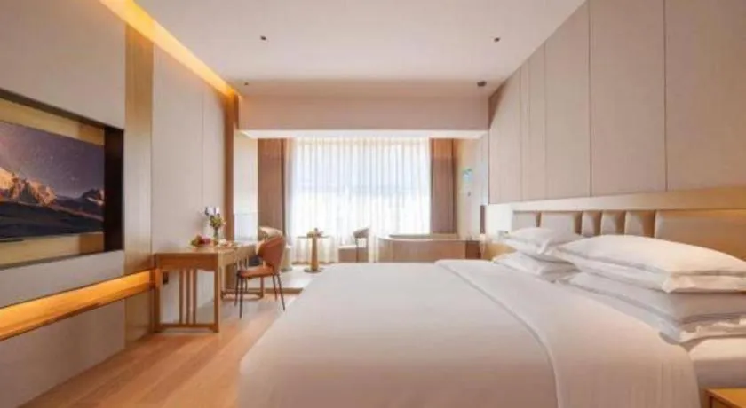 Bed in Vienna Hotel Yunnan Maitreya Huquan