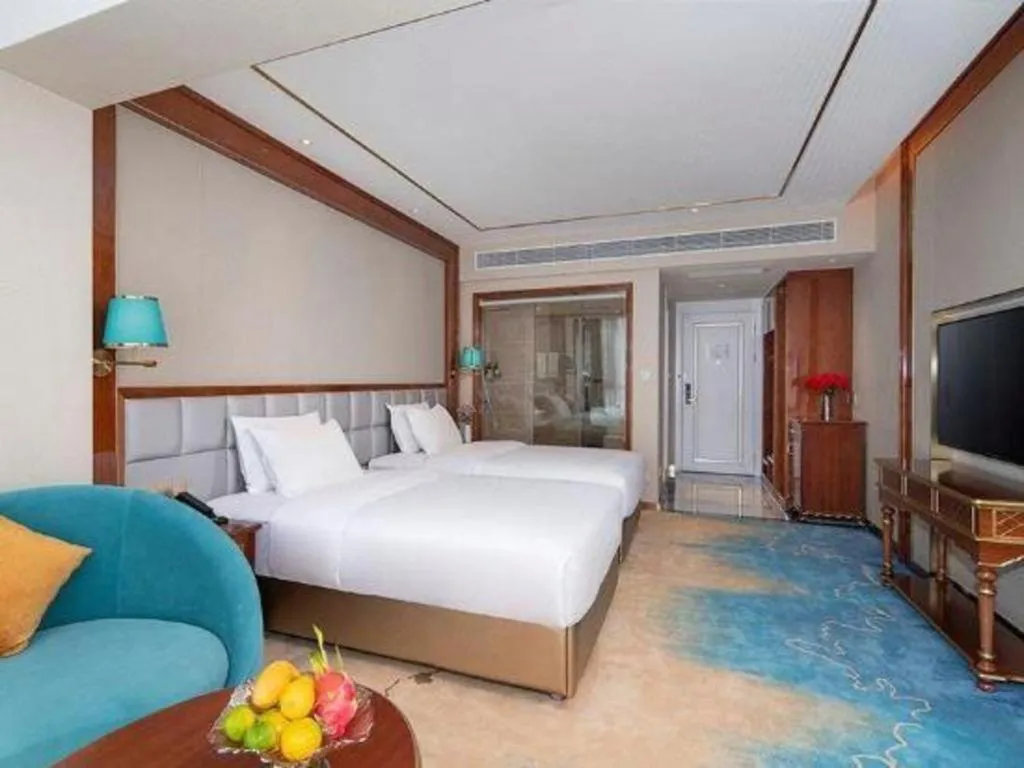 Bed in Vienna Hotel Yunnan Maitreya Huquan