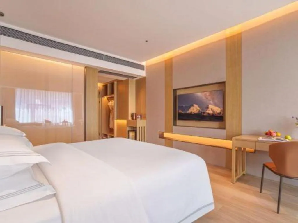 Bed in Vienna Hotel Yunnan Maitreya Huquan